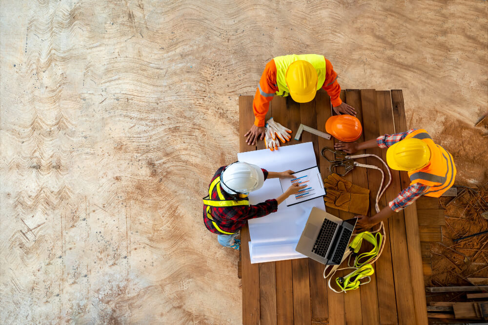 team-engineer-architects-working-meeting-discussing-designing-planning-measuring-layout-building-blueprints-construction-site-top-view-construction-concept